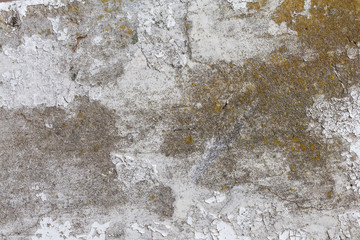 Grungy stone cement surface with peeling white paint background texture