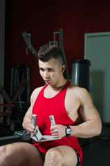 Fototapeta premium The guy is in the gym