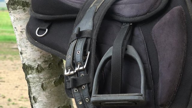 Detail of a horse saddle. Saddle with stirrups. 
