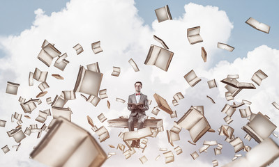 Young businessman or student studying the science and books fly 