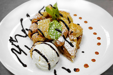 apple strudel with mint and ball of vanilla ice cream