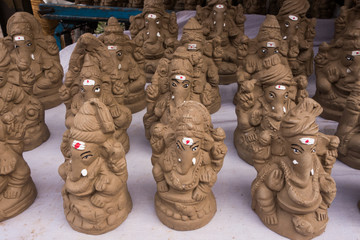 Eco-friendly Lord Ganesha clay idols for sale at a marketplace in Hyderabad,India