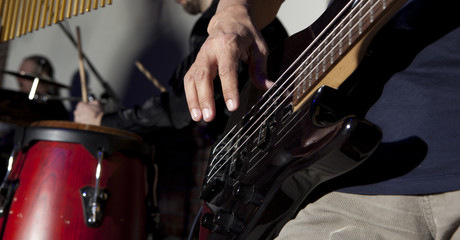 Fototapeta premium Bass guitar in hands of musician