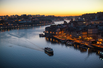 Douro river and Ribeira from Dom Luis I bridge at night time, Porto, Portugal.