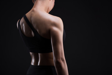 Naklejka premium Asian sporty woman with Arms Pain,on a black background,sport,fitness, bodybuilding,healthy and lifestyle concept.