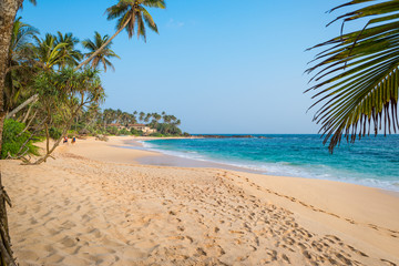 Obraz na płótnie Canvas The Amanwella beach in Tangalle in the southern province of Sri Lanka. The coastal town has a majestic bay and the most beautiful beaches in the south and south-east 