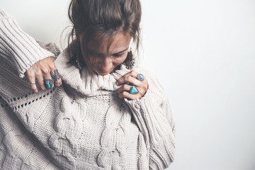 Boho jewelry and woolen sweater on model