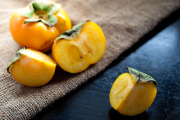persimmon fresh close up on background.