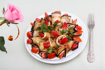 Fried eggplant slices with tomatoes and cheese sauce