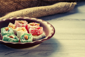 Turkish delight on clay plate with piece of sackcloth