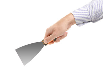 Man's hand holding spatula