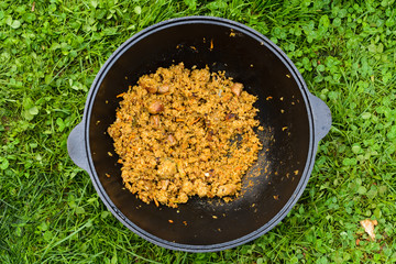 Preparation of pilaf in kazan