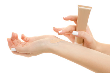 Female hand base cream beige