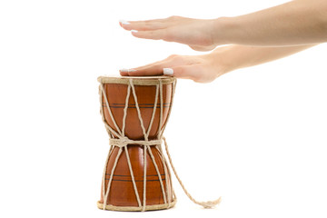 Fototapeta na wymiar Female hands little drum