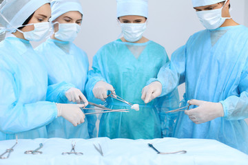 Medical team performing operation. Focus at male doctor 