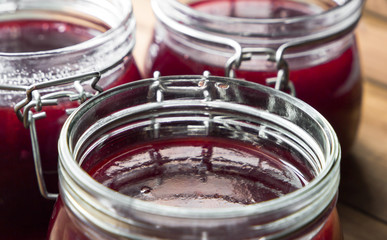 Close Up View Of Jars With Sweet Tasty Yummy Red Jam