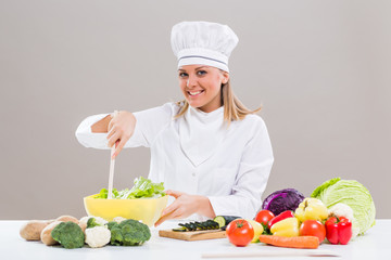 Female chef making healthy meal.