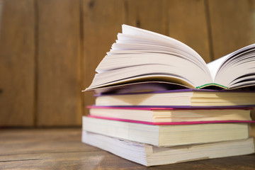 Open book on the wooden background