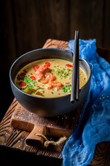 Tom Yum soup with shrimps on dark background