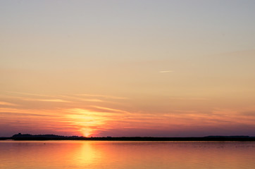 Obraz premium Sunset on the lake. Sunset in the water.
