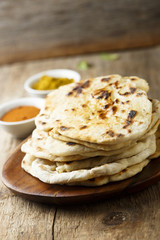 Indian naan bread on wooden desk