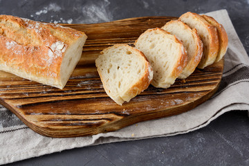 sliced bread on a wooden board.