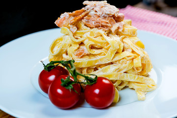 tasty pasta with salmon on a the table