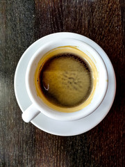 wonderful white cup of hot coffee on table