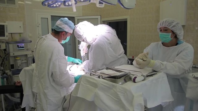 The hospital's medical team performs surgical intervention using new medical technologies