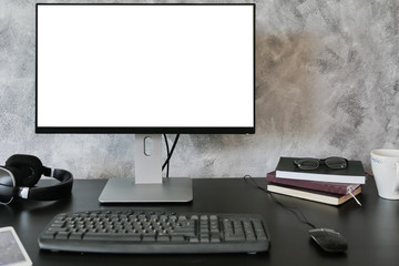 Computer with white screen monitor on the desk.