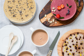Different raw healthy cheesecakes. Breakfast table. Top view