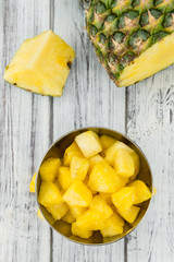 Wooden table with Sliced Pineapple, selective focus