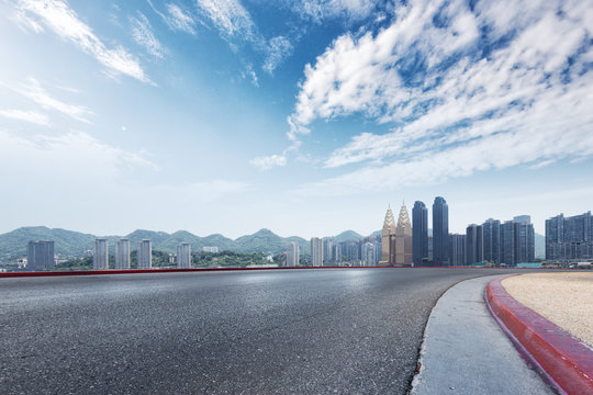 empty road and cityscape of modern city