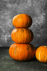 Ripe pumpkins on a green background