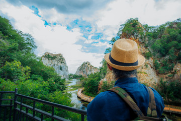 Fototapeta na wymiar Travel woman looking at beautiful landscape in Thailand.