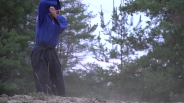 Samurai with a katana pushes a warrior with a halberd and becomes in a fighting position