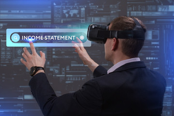 Business, Technology, Internet and network concept. Young businessman working on a virtual screen of the future and sees the inscription: Income statement