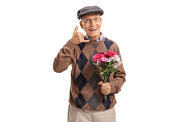 Happy senior with flowers making a call me gesture