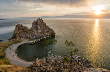 Summer sunset over Rock of Shamanka Burhan on Olkhon Island in Lake Baikal, Russia