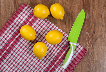 Still life of fresh lemons on a wooden table