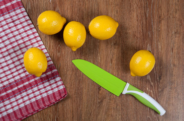 Still life of fresh lemons on a wooden table