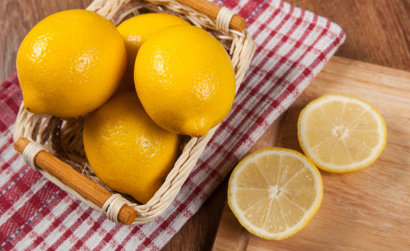 Still life of fresh lemons in a basket