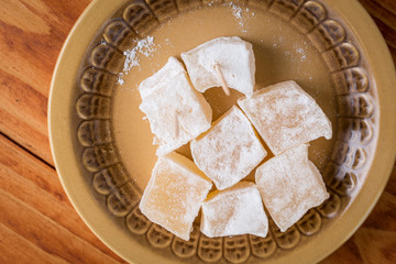 Flat lay above served turkish delight on the plate
