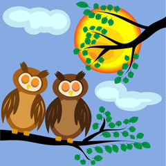 Two brown sleeping owls with closed eyes sit in the afternoon on a branch of a tree with leaves against the background of the sun, clear sky