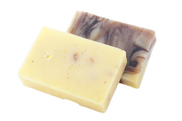 Two handmade chocolate chamomile soaps isolated on white background