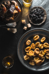 East-style tea-drinking with dates, dried apricots on a stone table