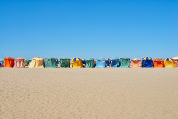 Traditional beach umbrellas in Trouville, Normandy France