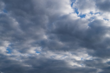 Dark stormy fkuffy clouds in the sky