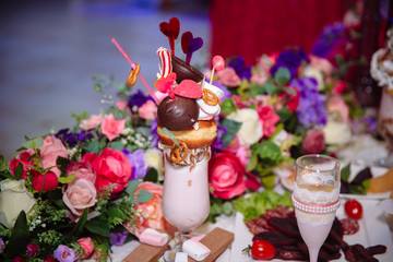 Candy bar. Table with sweets, buffet with cupcakes, candies, dessert.