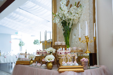 Candy bar. Table with sweets, buffet with cupcakes, candies, dessert.